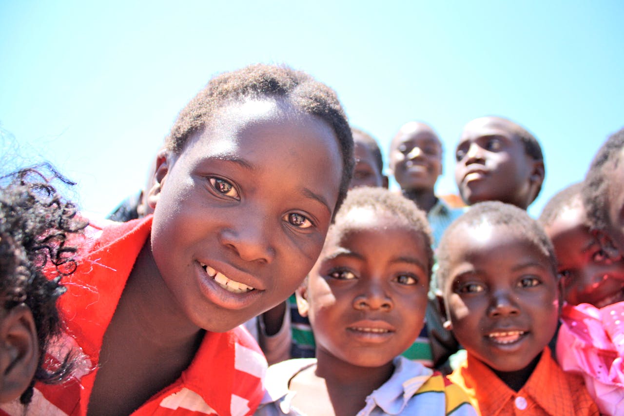 ours-journey A vibrant portrait of children smiling and enjoying a sunny day outdoors